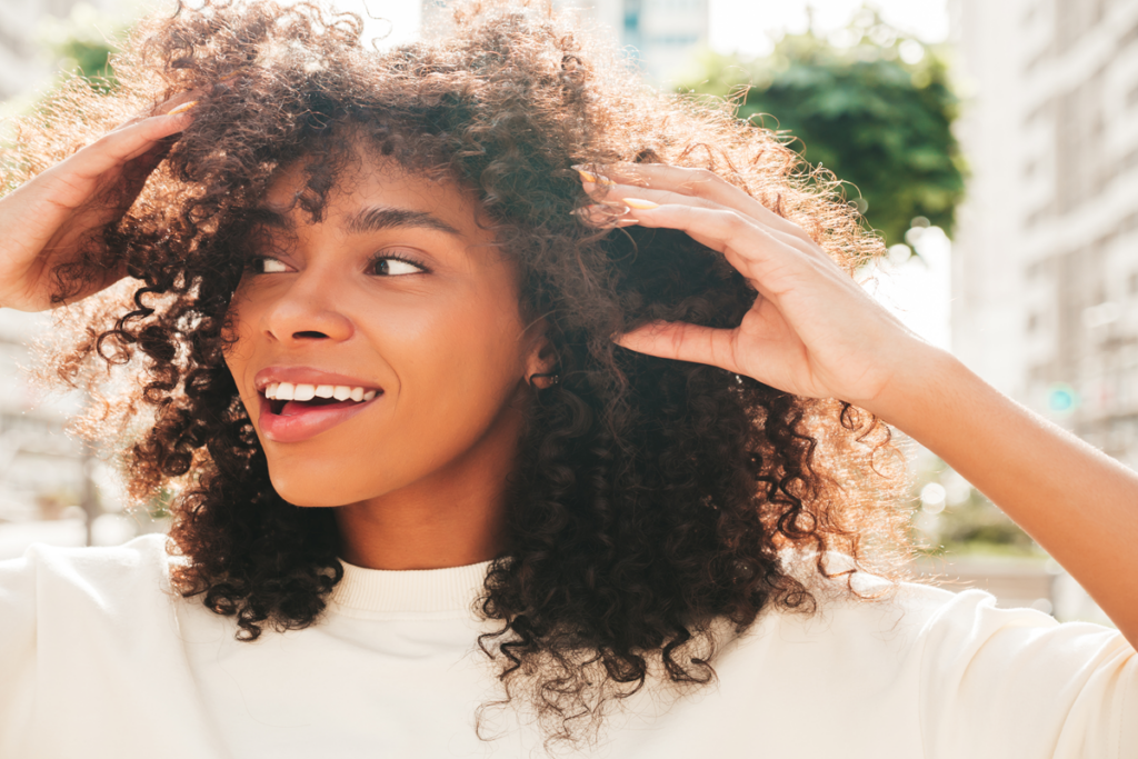 beautiful-black-woman-with-afro-curls-hairstylesmiling-hipster-model-white-tshirt-sexy-carefree-female-posing-street-background-cheerful-happy