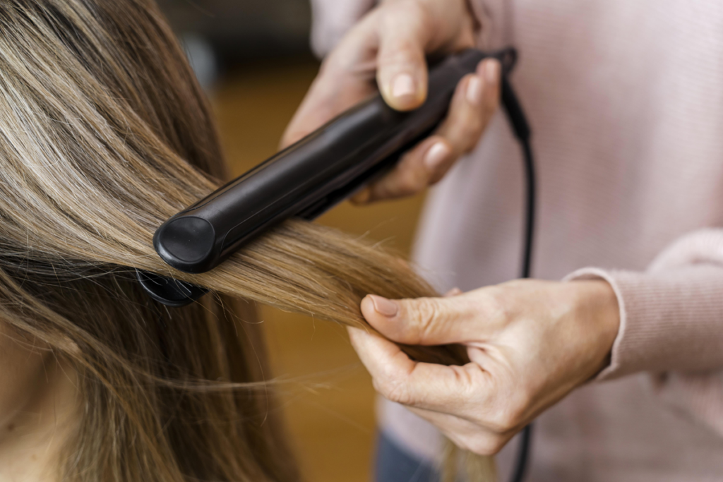 woman-getting-her-hair-straightened-home.